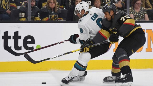 LAS VEGAS, NEVADA - APRIL 16: Evander Kane #9 of the San Jose Sharks skates with the puck against Ryan Reaves #75 of the Vegas Golden Knights in the second period of Game Four of the Western Conference First Round during the 2019 NHL Stanley Cup Playoffs at T-Mobile Arena on April 16, 2019 in Las Vegas, Nevada. The Golden Knights defeated the Sharks 5-0 to take a 3-1 lead in the series.