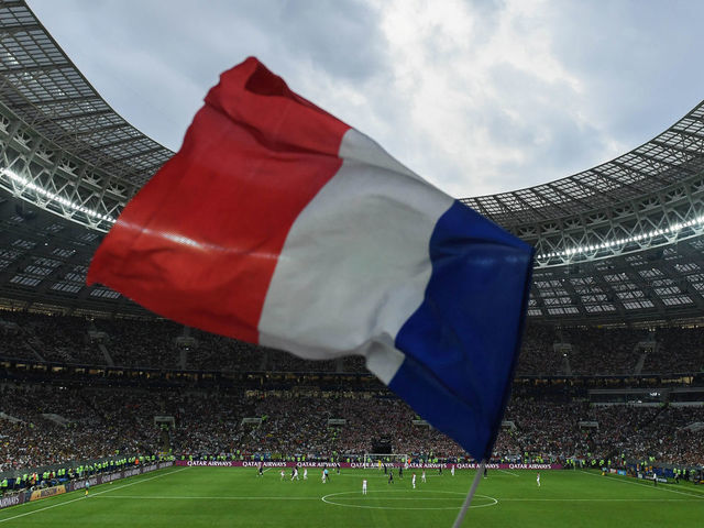 MOSCOW, RUSSIA - JULY 15: A general view inside the stadium as a France flag is flown in support during the 2018 FIFA World Cup Russia Final between France and Croatia at Luzhniki Stadium on July 15, 2018 in Moscow, Russia.