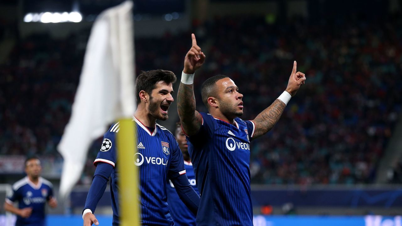 Lyon's Dutch forward Memphis Depay celebrates scoring the opening goal with his teammates during the UEFA Champions League Group G football match RB Leipzig v Olympique Lyonnais (OL) in Leipzig, eastern Germany, on October 2, 2019.