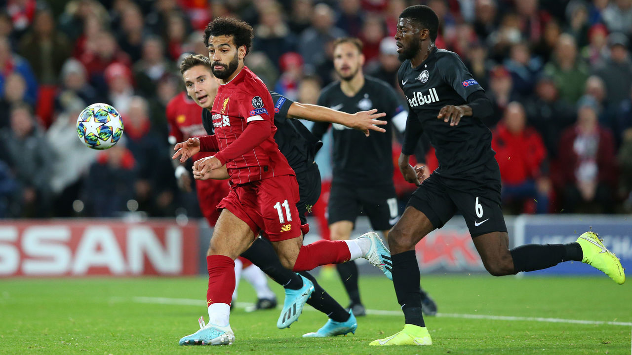 LIVERPOOL, ENGLAND - OCTOBER 02: Mohamed Salah of Liverpool scores his sides fourth goal during the UEFA Champions League group E match between Liverpool FC and RB Salzburg at Anfield on October 02, 2019 in Liverpool, United Kingdom.
