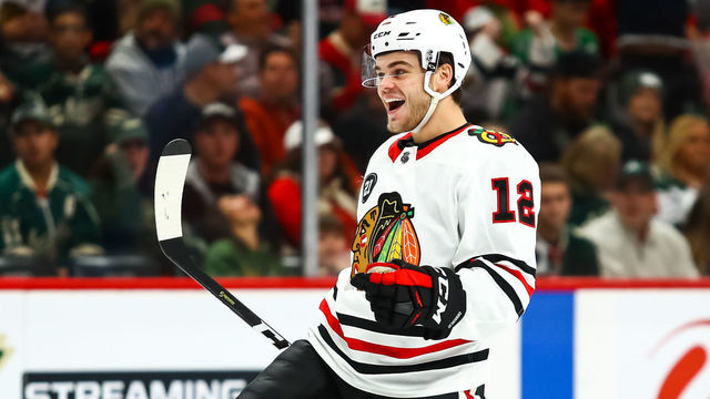 ST. PAUL, MN - OCTOBER 11: Chicago Blackhawks right wing Alex DeBrincat (12) celebrates after scoring in the 3rd period to make it 3-2 Chicago during the regular season game between the Chicago Blackhawks and the Minnesota Wild on October 11, 2018 at Xcel Energy Center in St. Paul, Minnesota. The Wild defeated the Blackhawks 4-3 in overtime.