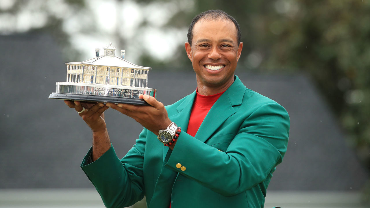 AUGUSTA, GEORGIA - APRIL 14: Tiger Woods of the United States celebrates with the Masters Trophy during the Green Jacket Ceremony after winning the Masters at Augusta National Golf Club on April 14, 2019 in Augusta, Georgia.