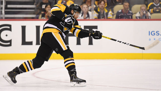 PITTSBURGH, PA - SEPTEMBER 19: Pittsburgh Penguins center Alex Galchenyuk (18) shoots the puck during the first period in the NHL game between the Pittsburgh Penguins and the Columbus Blue Jackets on September 19, 2019, at PPG Paints Arena in Pittsburgh, PA.