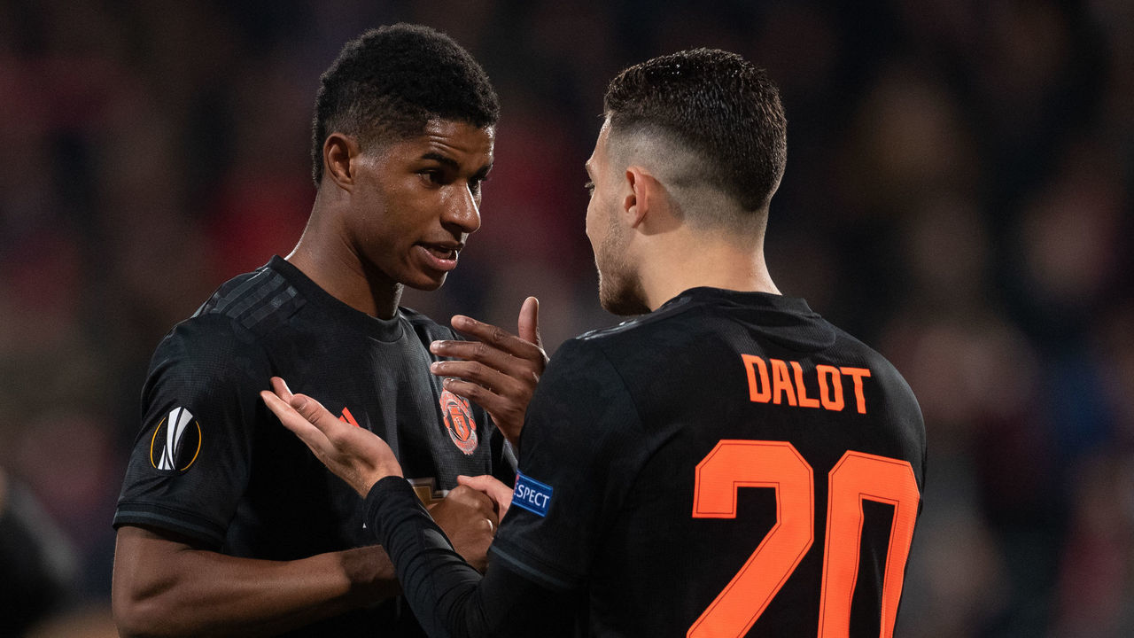 Manchester United's Marcus Rashford (left) speaks to Diogo Dalot during the UEFA Europa League Group L match at the Cars Jeans Stadion, The Hague.