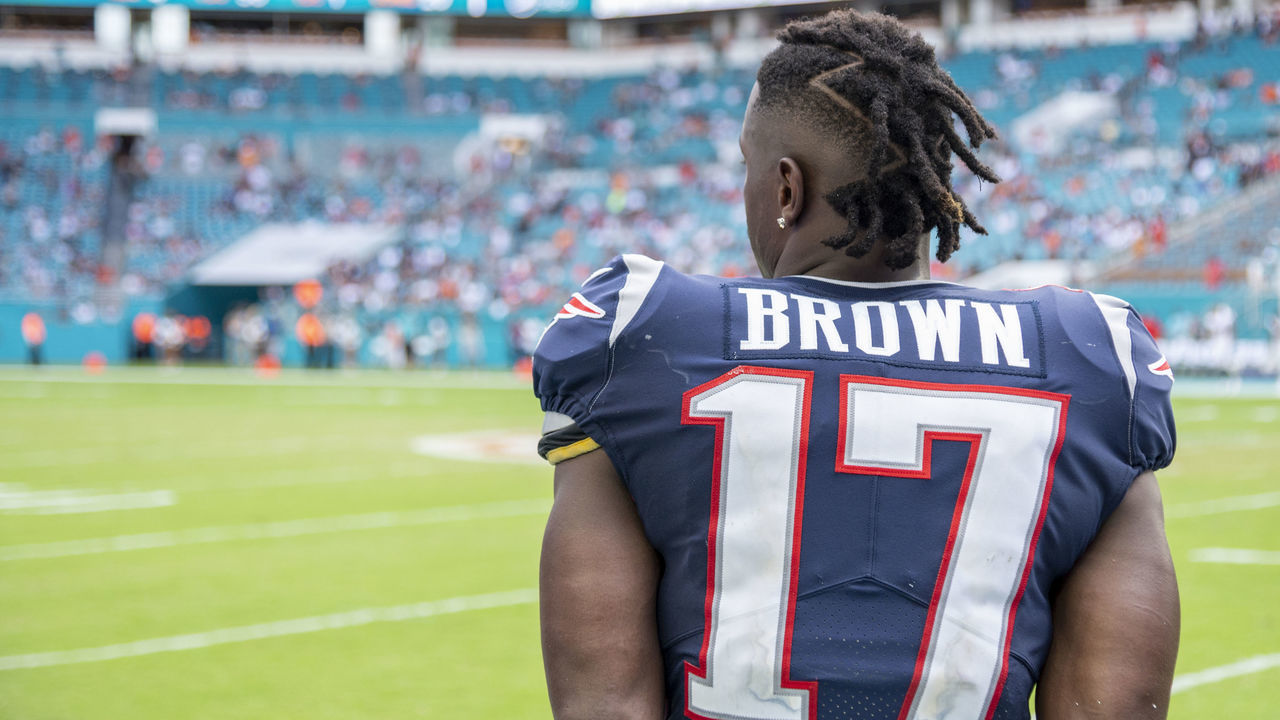 MIAMI GARDENS, FL - SEPTEMBER 15: New England Patriots Wide Receiver Antonio Brown (17) watches the game on the sidelines during the NFL game between the New England Patriots and the Miami Dolphins at the Hard Rock Stadium in Miami Gardens, Florida on September 15, 2019.