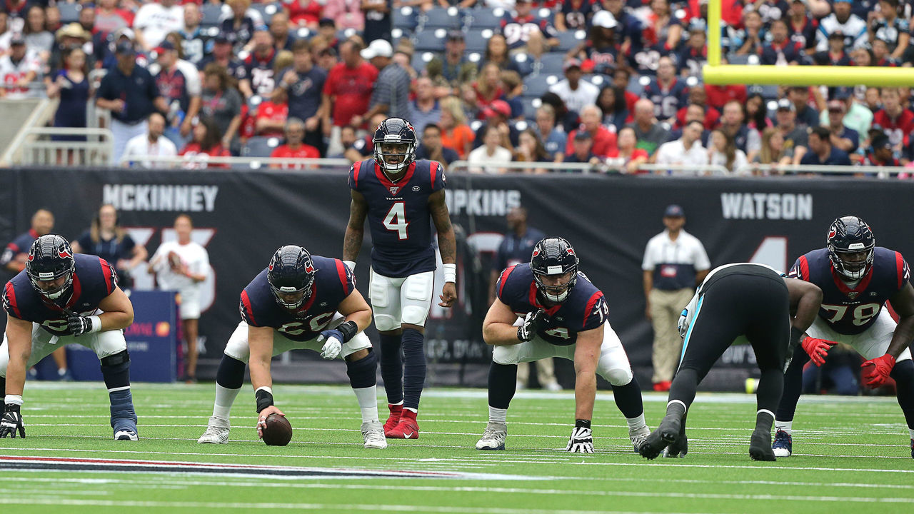 HOUSTON, TEXAS - SEPTEMBER 29: Deshaun Watson #4 of the Houston Texans lines up behind his offensive line against the Carolina Panthers at NRG Stadium on September 29, 2019 in Houston, Texas.