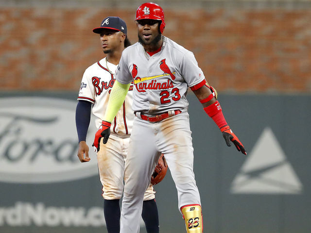 ATLANTA, GEORGIA - OCTOBER 03: Marcell Ozuna #23 of the St. Louis Cardinals celebrates after hitting a two-RBI double against the Atlanta Braves during the ninth inning in game one of the National League Division Series at SunTrust Park on October 03, 2019 in Atlanta, Georgia.