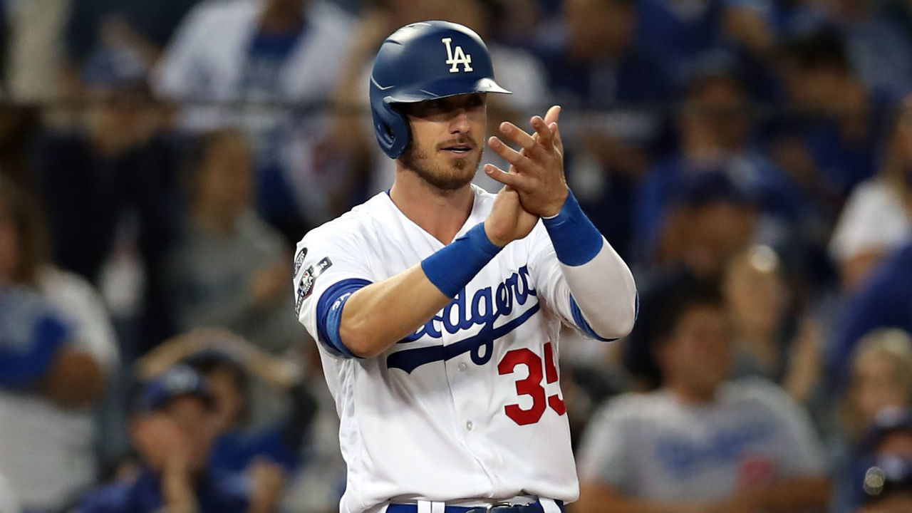 LOS ANGELES, CA - OCTOBER 03: Cody Bellinger #35 of the Los Angeles Dodgers celebrates standing at third against the Washington Nationals during Game 1 of the NLDS at Dodger Stadium on Thursday, October 3, 2019 in Los Angeles, California.