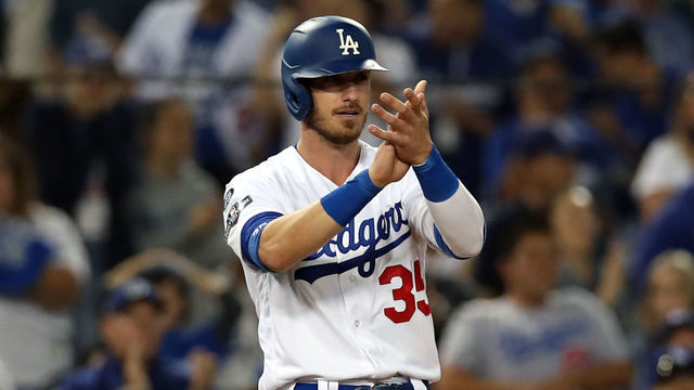 LOS ANGELES, CA - OCTOBER 03: Cody Bellinger #35 of the Los Angeles Dodgers celebrates standing at third against the Washington Nationals during Game 1 of the NLDS at Dodger Stadium on Thursday, October 3, 2019 in Los Angeles, California.