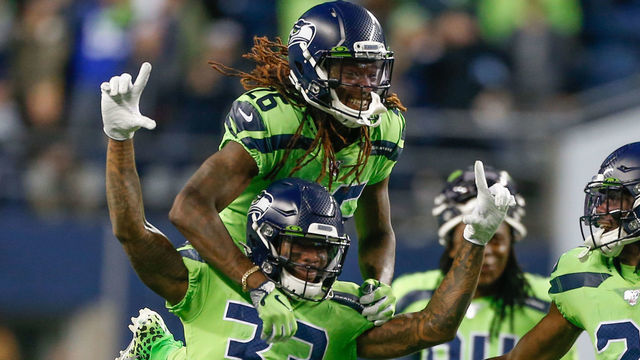 SEATTLE, WA - OCTOBER 03: Free safety Tedric Thompson #33 and cornerback Shaquill Griffin #26 of the Seattle Seahawks celebrate in the fourth quarter against the Los Angeles Rams at CenturyLink Field on October 3, 2019 in Seattle, Washington.