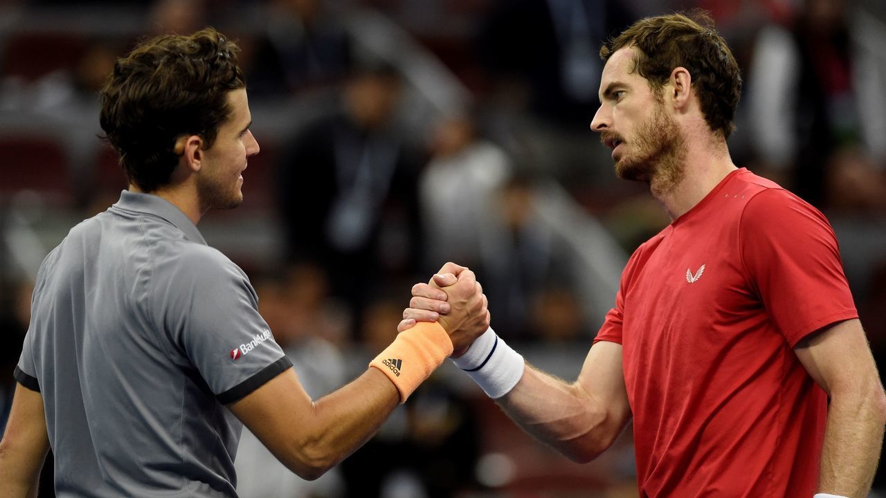 Andy Murray of Britain (R) shakes hands with Dominic Thiem of Austria after their men's singles quarter-final match at the China Open tennis tournament in Beijing on October 4, 2019.