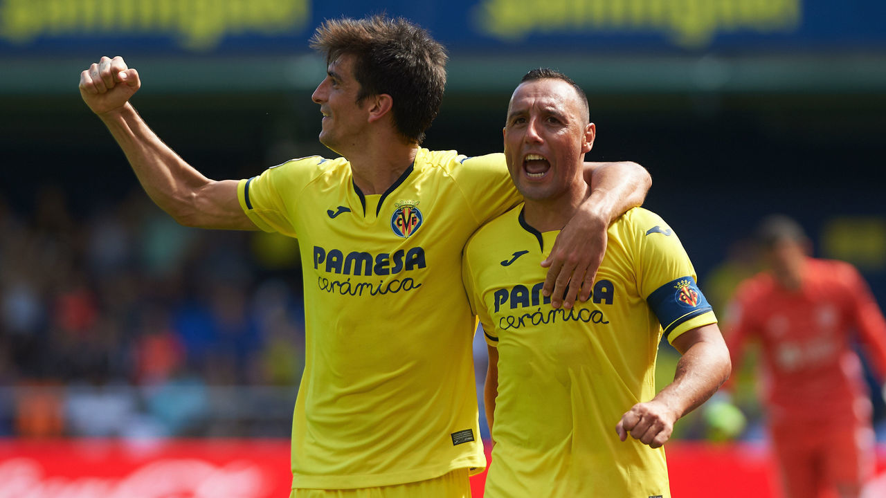Gerard Moreno and Santi Cazorla of Villarreal celebrates a goal during the La Liga Santander match between Villarreal and Valladolid at Estadio de la Ceramica, on September 21 in Vila-real, Spain