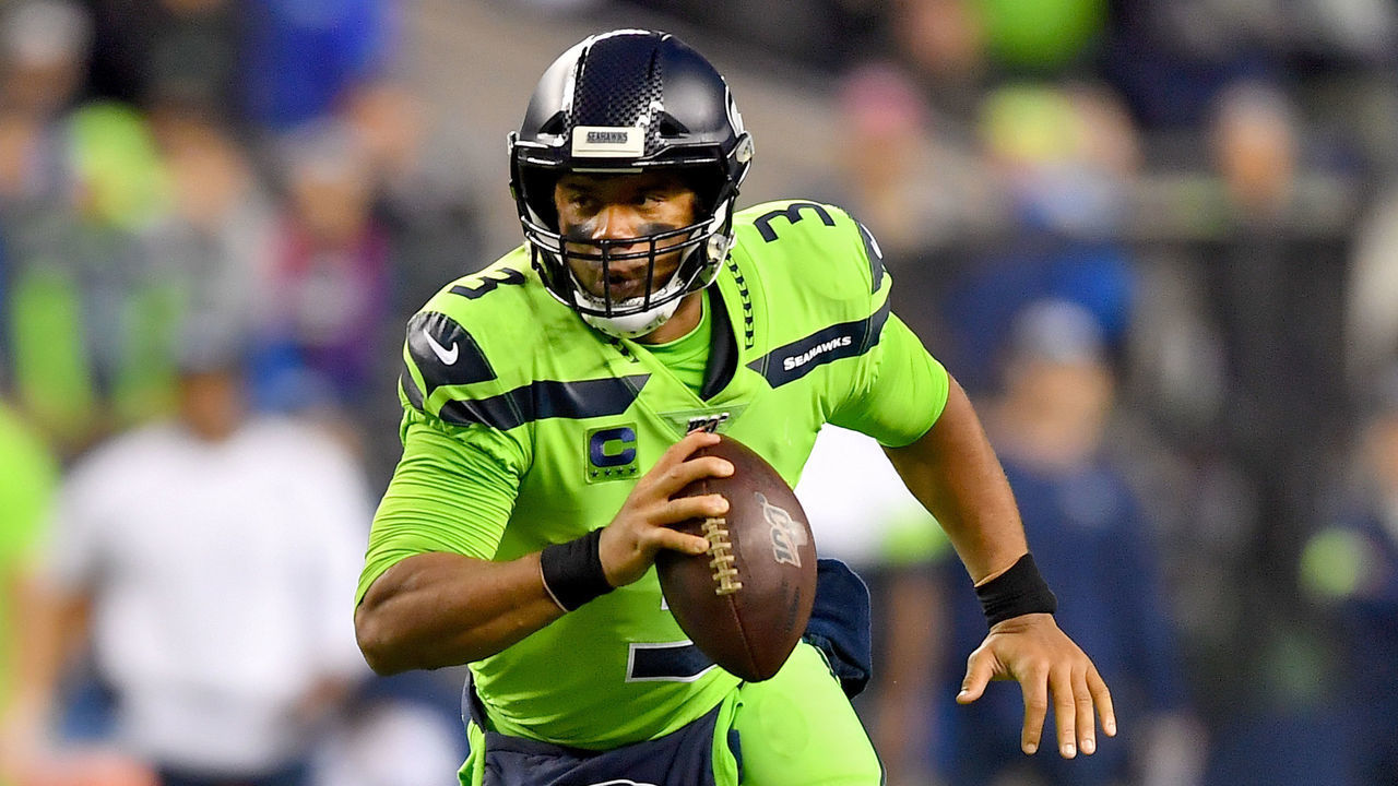 SEATTLE, WASHINGTON - OCTOBER 03: Russell Wilson #3 of the Seattle Seahawks scrambles out of the pocket during the game against the Los Angeles Rams at CenturyLink Field on October 03, 2019 in Seattle, Washington. The Seattle Seahawks top the Los Angeles Rams 30-29.