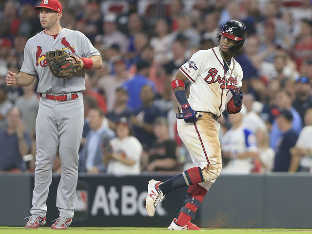 ATLANTA, GA - OCTOBER 03: Ronald Acuna Jr. (13) of the Atlanta Braves heads back to first base during the first game of the National League Division Series between the Atlanta Braves and the St. Louis Cardinals on October 3, 2019 at Suntrust Park in Atlanta, Georgia.
