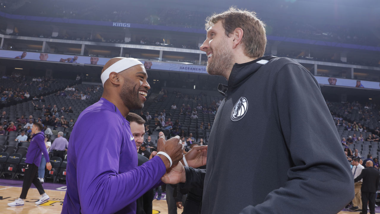 SACRAMENTO, CA - MARCH 27: Vince Carter #15 of the Sacramento Kings greets Dirk Nowitzki #41 of the Dallas Mavericks on March 27, 2018 at Golden 1 Center in Sacramento, California. NOTE TO USER: User expressly acknowledges and agrees that, by downloading and or using this photograph, User is consenting to the terms and conditions of the Getty Images Agreement. Mandatory Copyright Notice: Copyright 2018 NBAE