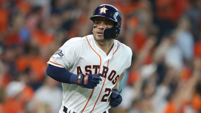 HOUSTON, TEXAS - OCTOBER 04: Jose Altuve #27 of the Houston Astros hits a two-run home run off of Tyler Glasnow #20 of the Tampa Bay Rays (not pictured) during the fifth inning in game one of the American League Division Series at Minute Maid Park on October 04, 2019 in Houston, Texas.