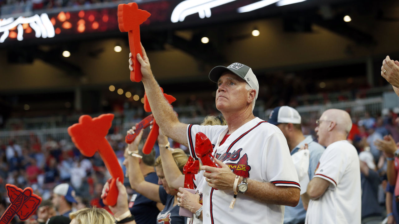 ATLANTA, GA - OCTOBER 03: A fan looks on and cheers during the NLDS Game 1 between the St. Louis Cardinals and the Atlanta Braves at SunTrust Park on Thursday, October 3, 2019 in Atlanta, Georgia.