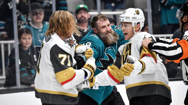 SAN JOSE, CA - OCTOBER 04: Joe Thornton #19 of the San Jose Sharks holds onto Jonathan Marchessault #81 and William Karlsson #71 of the Vegas Golden Knights at SAP Center on October 4, 2019 in San Jose, California.