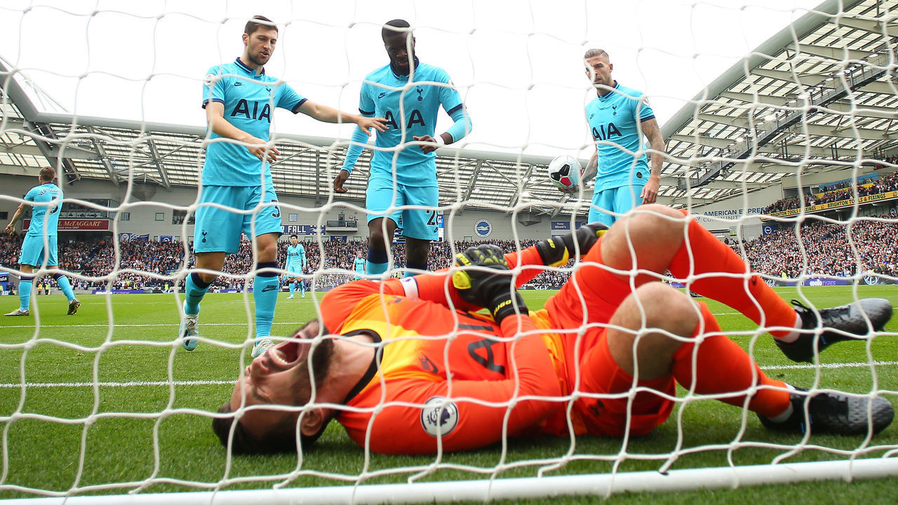 BRIGHTON, ENGLAND - OCTOBER 05: Hugo Lloris of Tottenham Hotspur goes down injured during the Premier League match between Brighton & Hove Albion and Tottenham Hotspur at American Express Community Stadium on October 05, 2019 in Brighton, United Kingdom.