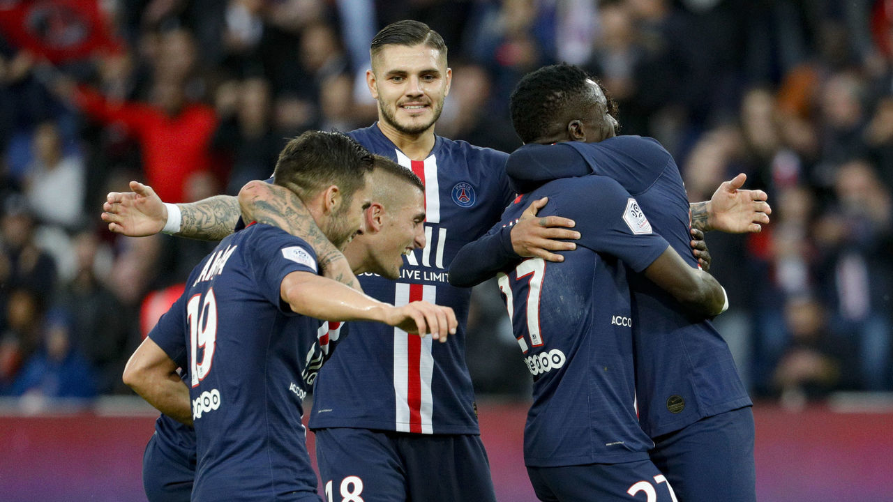 Paris Saint-Germain's Senegalese midfielder Idrissa Gueye (2nd R) is congratuled by his teammates after scoring a goal during the French L1 football match between Paris Saint-Germain and Angers SCO at the Parc des Princes stadium in Paris on October 5, 2019.