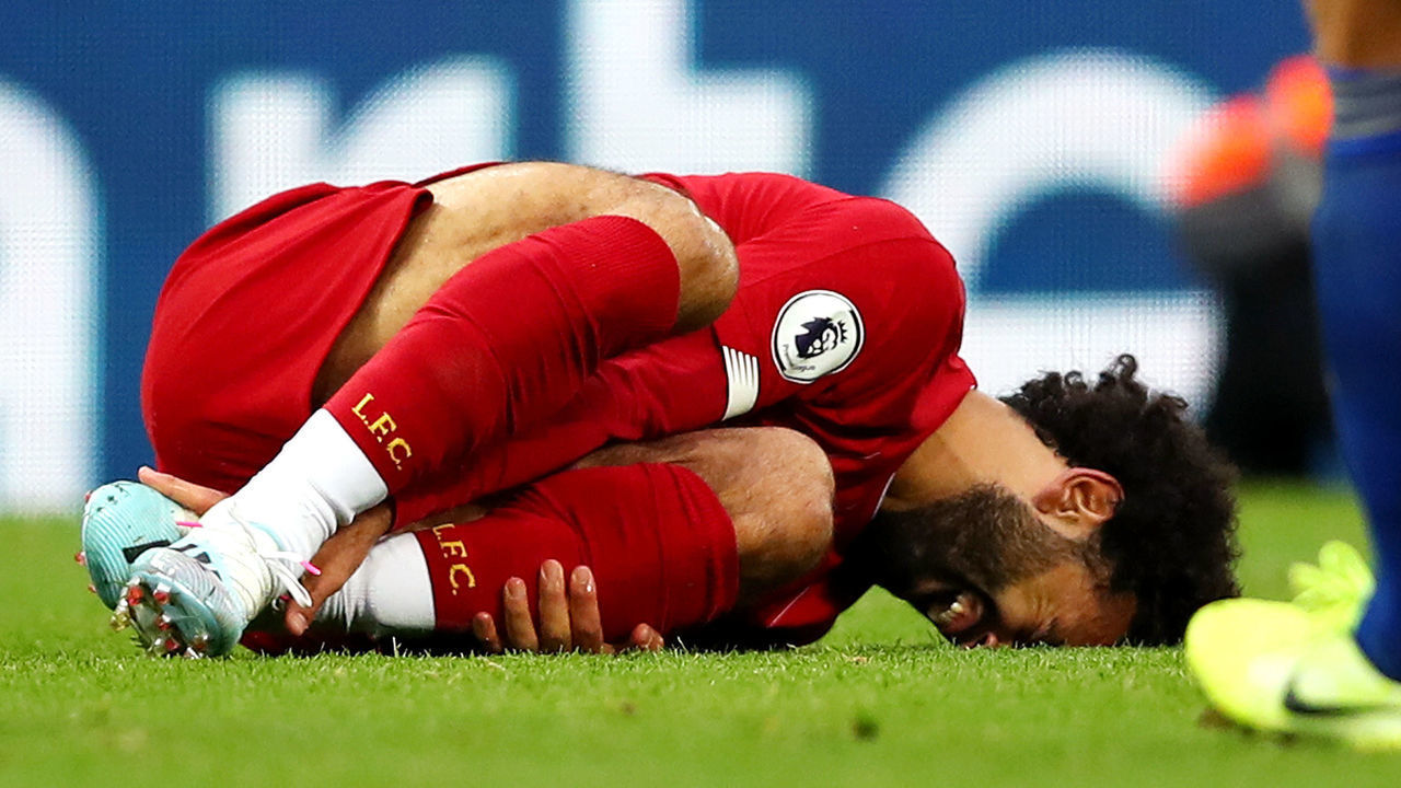 LIVERPOOL, ENGLAND - OCTOBER 05: Mohamed Salah of Liverpool is injured during the Premier League match between Liverpool FC and Leicester City at Anfield on October 05, 2019 in Liverpool, United Kingdom.