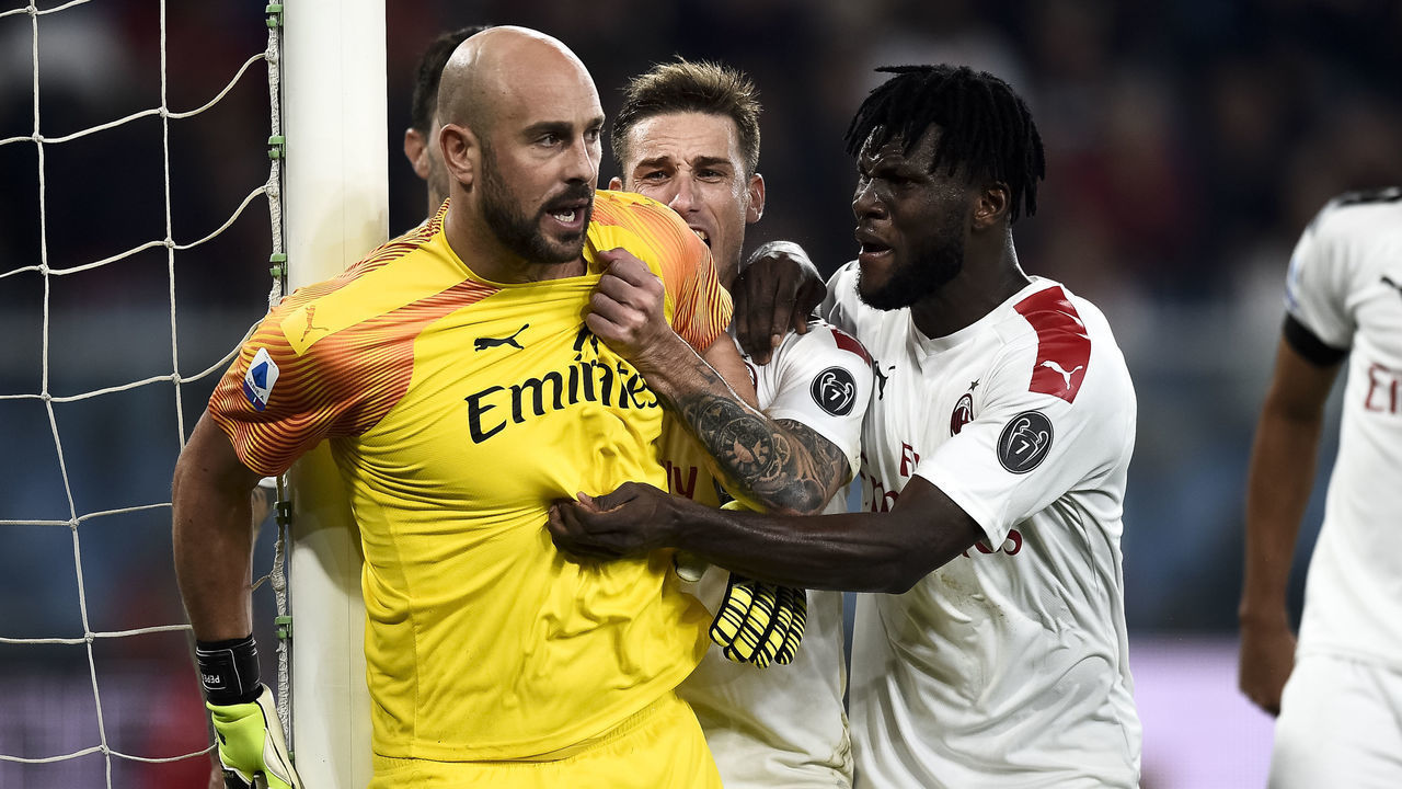 STADIO LUIGI FERRARIS, GENOA, ITALY - 2019/10/05: Pepe Reina (L) of AC Milan celebrates with his teammates after saving a penalty kick from Lasse Schone of Genoa CFC during the Serie A football match between Genoa CFC and AC Milan. AC Milan won 2-1 over Genoa CFC.