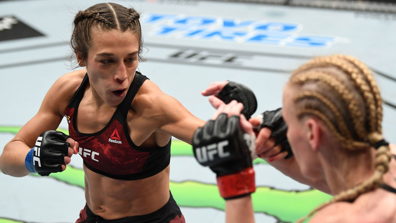 TORONTO, CANADA - DECEMBER 08: (L-R) Joanna Jedrzejczyk of Poland punches Valentina Shevchenko of Kyrgyzstan in their UFC strawweight championship fight during the UFC 231 event at Scotiabank Arena on December 8, 2018 in Toronto, Canada.
