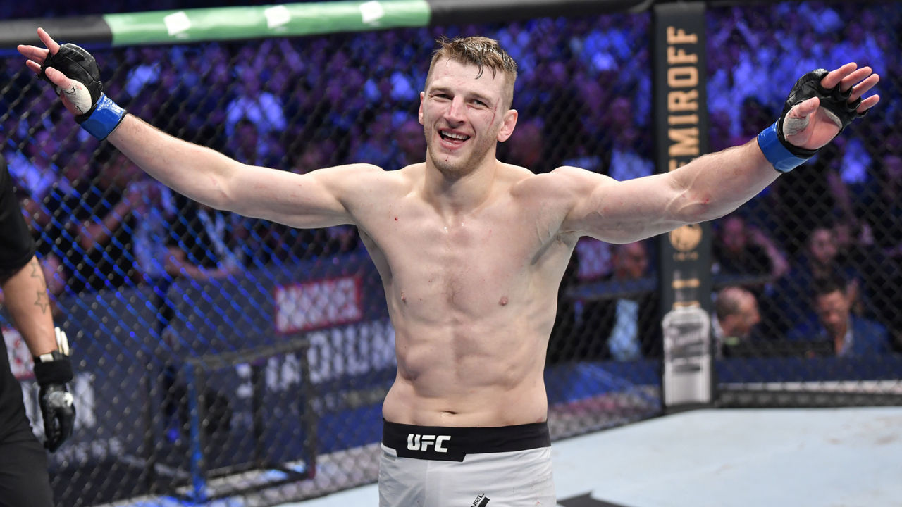 MELBOURNE, AUSTRALIA - OCTOBER 06: Dan Hooker of New Zealand celebrates after defeating Al Iaquinta in their lightweight fight during the UFC 243 event at Marvel Stadium on October 06, 2019 in Melbourne, Australia.