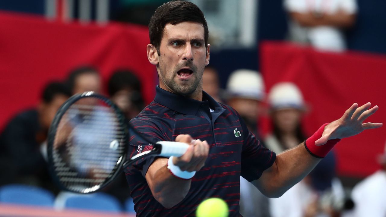 Serbia's Novak Djokovic hits a return against Australia's John Millman in their mens singles final match at the Japan Open Tennis tournament in Tokyo on October 6, 2019.