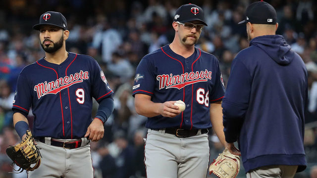 NEW YORK, NEW YORK - OCTOBER 05: Randy Dobnak #68 of the Minnesota Twins is pulled by Rocco Baldelli #5 after loading the bases in the third inning in game two of the American League Division Series at Yankee Stadium on October 05, 2019 in New York City.