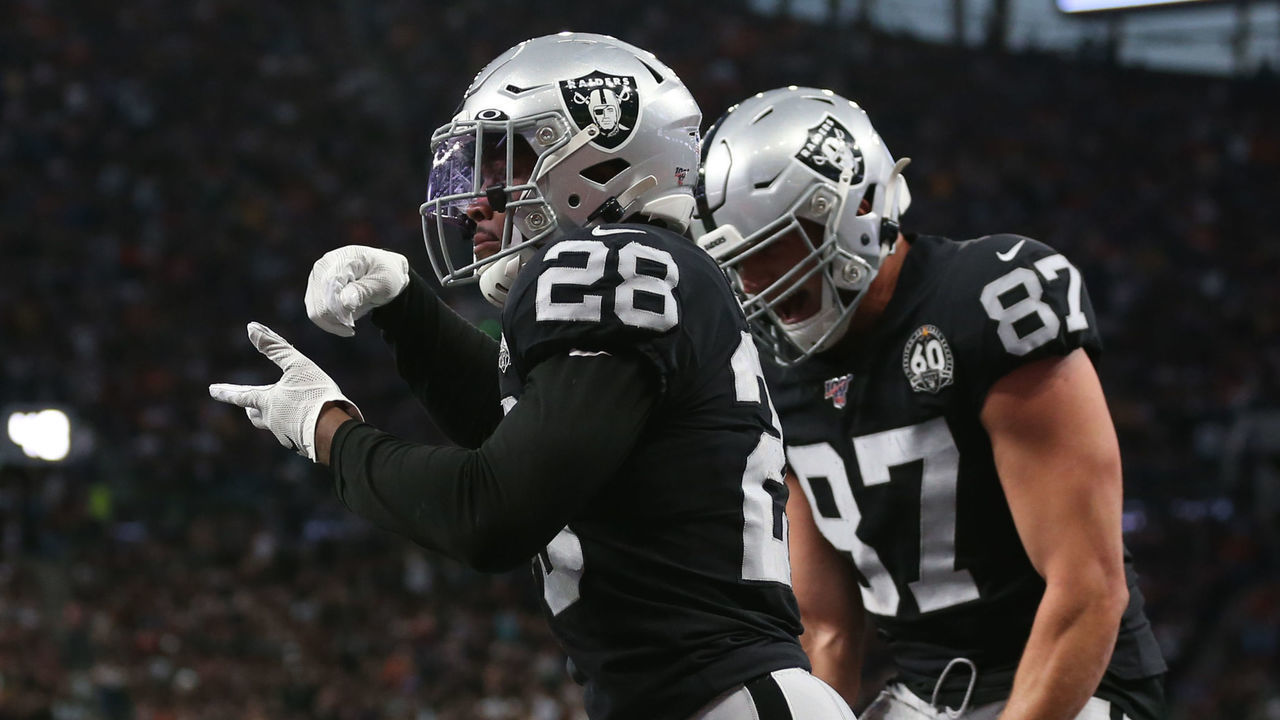 Oakland Raiders Josh Jacobs celebrates scoring his side's 1st touchdown with teammates during the NFL International Series match at Tottenham Hotspur Stadium, London.