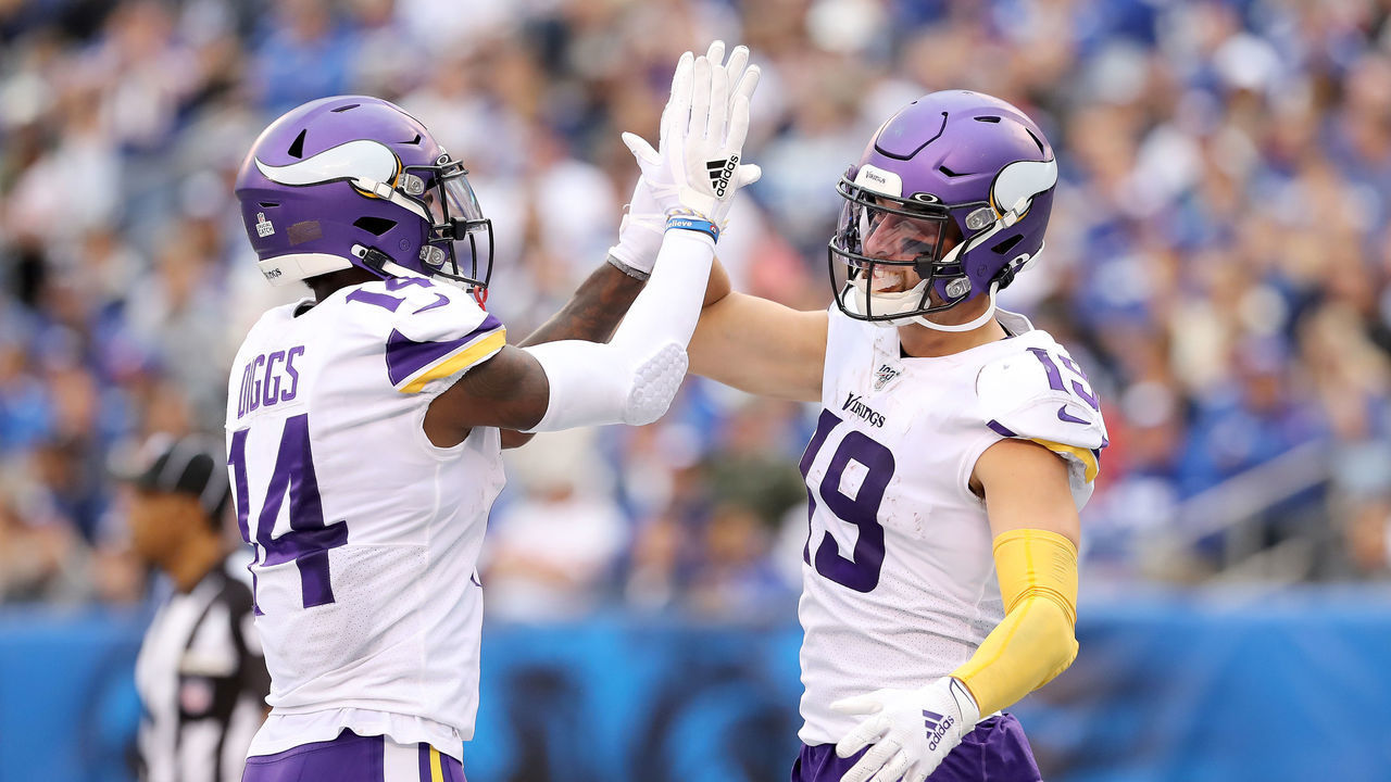 EAST RUTHERFORD, NEW JERSEY - OCTOBER 06: Stefon Diggs #14 of the Minnesota Vikings congratulates teammate Adam Thielen #19 after he scored a touchdown in the third quarter against the New York Giants at MetLife Stadium on October 06, 2019 in East Rutherford, New Jersey.