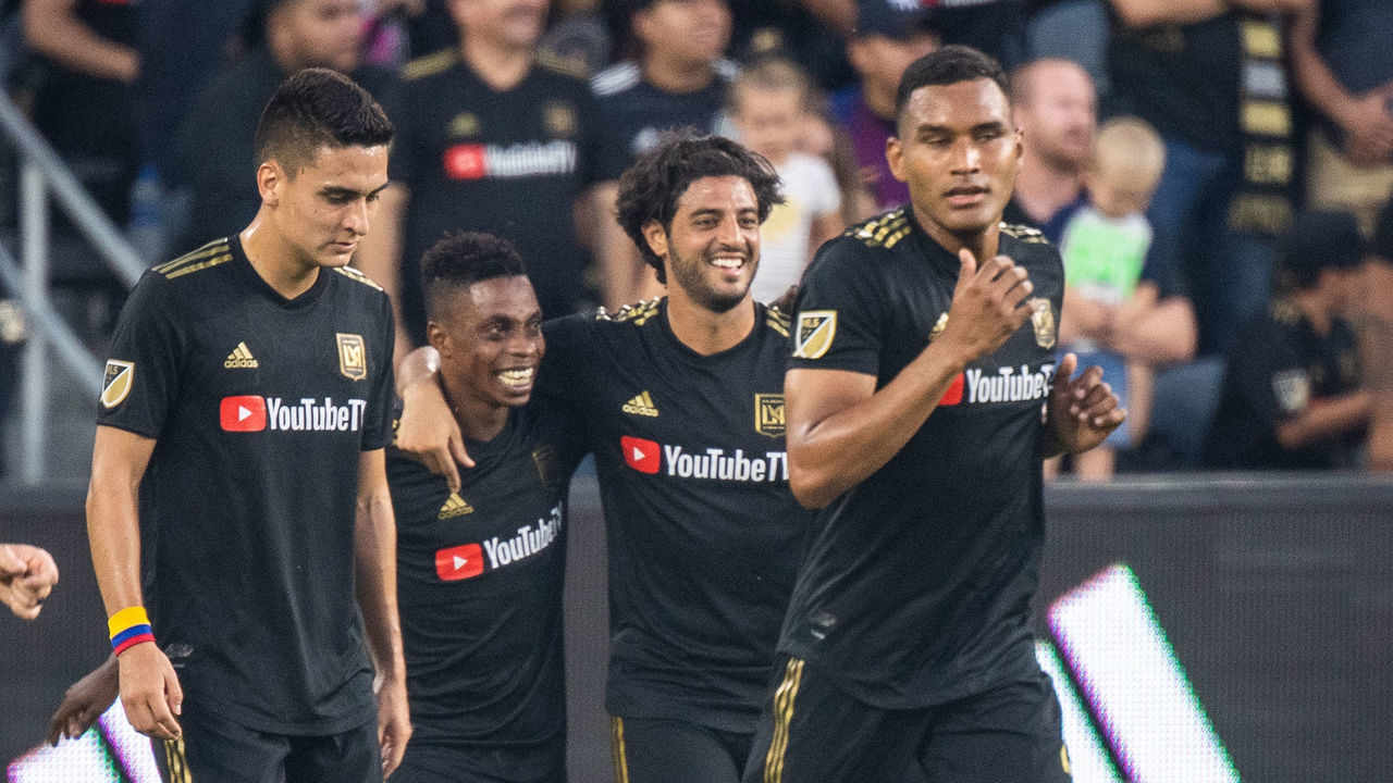 LOS ANGELES, CA - AUGUST 11: Latif Blessing #7 of Los Angeles FC celebrates his goal with Carlos Vela #10 of Los Angeles FC during Los Angeles FC's MLS match against New York Red Bulls at the Banc of California Stadium on August 11, 2019 in Los Angeles, California. Los Angeles FC won the match 4-2
