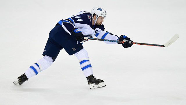 NEW YORK, NEW YORK - OCTOBER 03: Josh Morrissey #44 of the Winnipeg Jets takes a shot during their game against the New York Rangers at Madison Square Garden on October 03, 2019 in New York City.