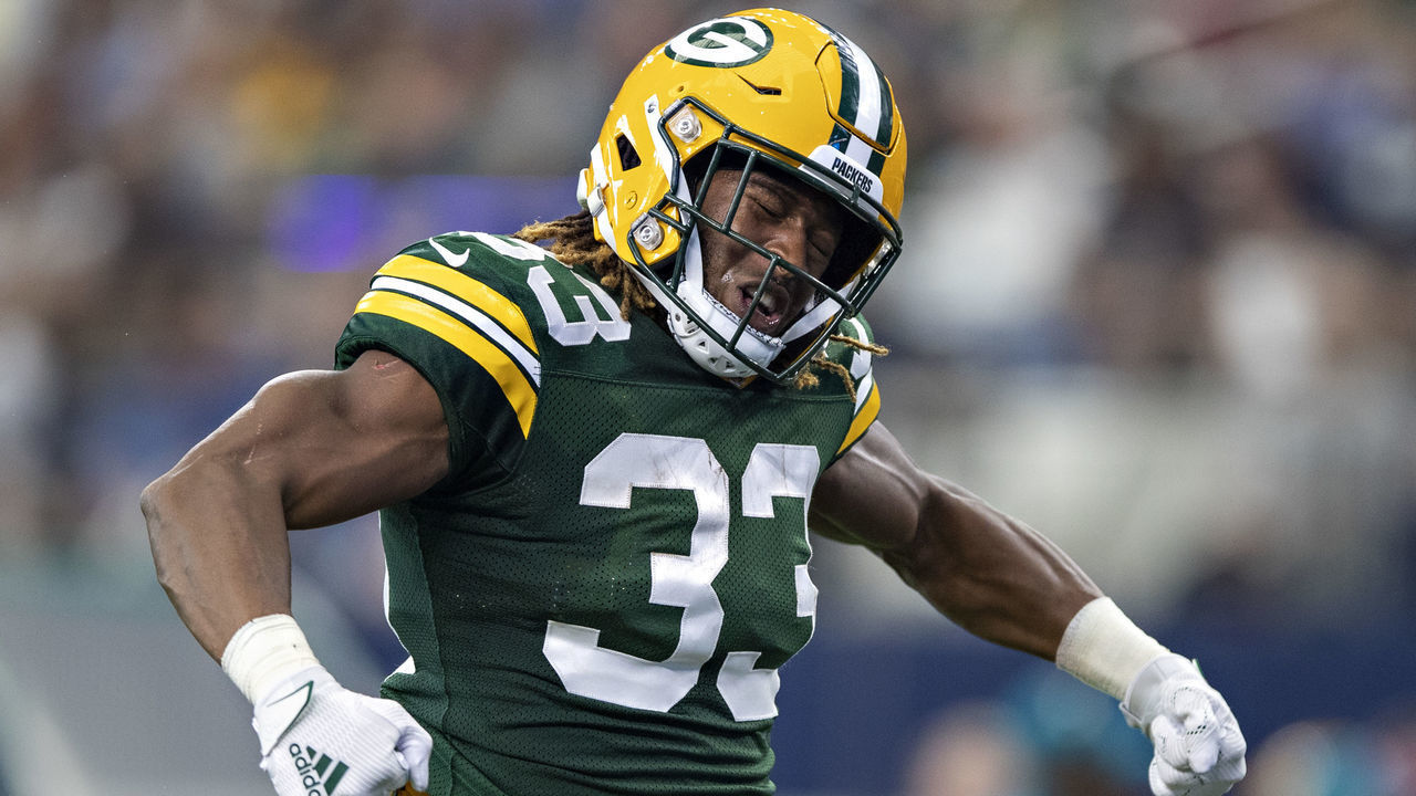 ARLINGTON, TX - OCTOBER 6: Aaron Jones #33 of the Green Bay Packers flexes his muscles after scoring a touchdown during a game against the Dallas Cowboys at AT&T Stadium on October 6, 2019 in Arlington, Texas.