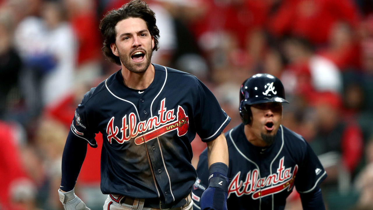 ST LOUIS, MISSOURI - OCTOBER 06: Dansby Swanson #7 and Rafael Ortega #18 of the Atlanta Braves celebrate after scoring the go-ahead runs against the St. Louis Cardinals during the ninth inning in game three of the National League Division Series at Busch Stadium on October 06, 2019 in St Louis, Missouri.