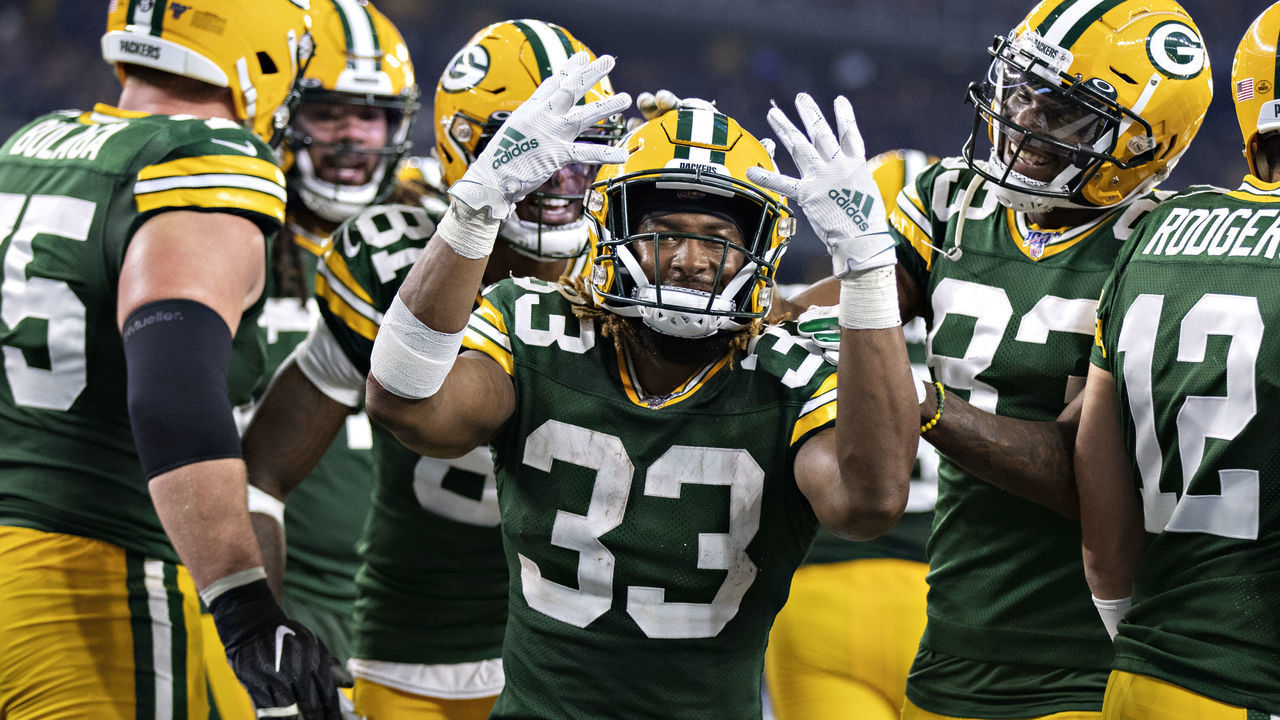 ARLINGTON, TX - OCTOBER 6: Aaron Jones #33 of the Green Bay Packers celebrates after scoring his fourth touchdown during a game against the Dallas Cowboys at AT&T Stadium on October 6, 2019 in Arlington, Texas.