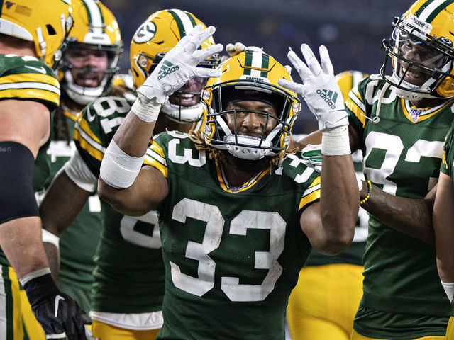 ARLINGTON, TX - OCTOBER 6: Aaron Jones #33 of the Green Bay Packers celebrates after scoring his fourth touchdown during a game against the Dallas Cowboys at AT&T Stadium on October 6, 2019 in Arlington, Texas.