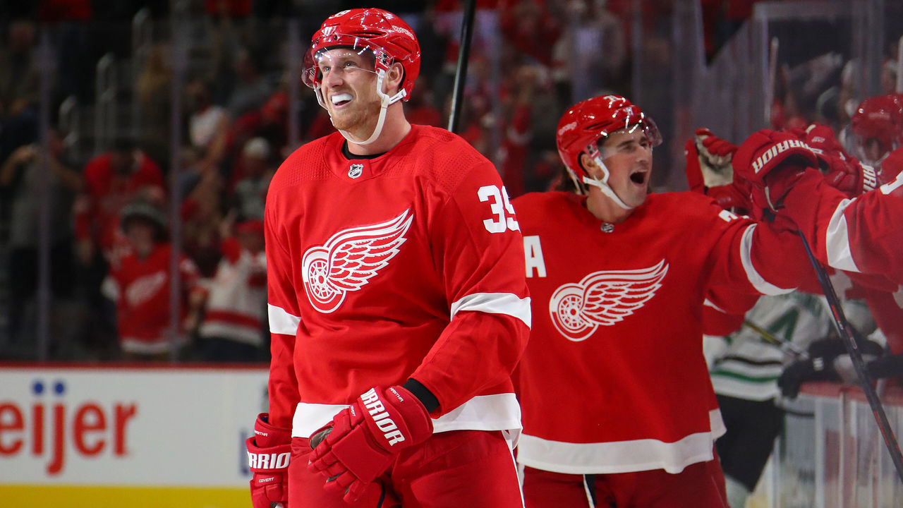 DETROIT, MICHIGAN - OCTOBER 06: Anthony Mantha #39 of the Detroit Red Wings celebrates his game winning and fourth goal of the game with Dylan Larkin #71 while playing the Dallas Stars at Little Caesars Arena on October 06, 2019 in Detroit, Michigan. Detroit won the game 4-3.