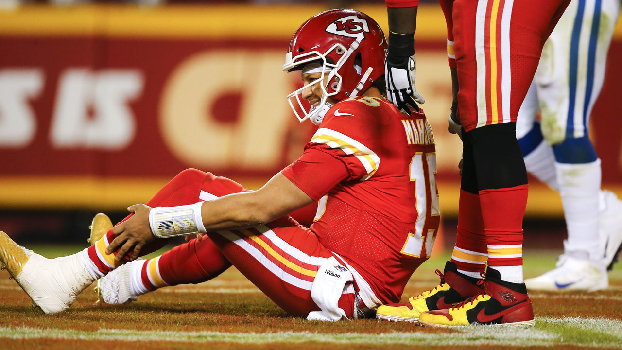 KANSAS CITY, MO - OCTOBER 06: Patrick Mahomes #15 of the Kansas City Chiefs grimaces as he holds his left leg after being hit in the third quarter by the Indianapolis Colts at Arrowhead Stadium on October 6, 2019 in Kansas City, Missouri.