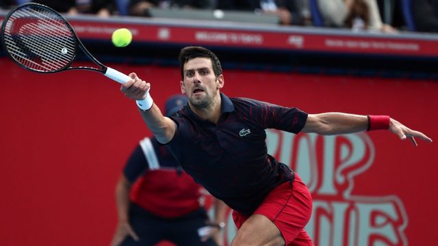 Serbia's Novak Djokovic hits a return against Australia's John Millman in their mens singles final match at the Japan Open Tennis tournament in Tokyo on October 6, 2019.