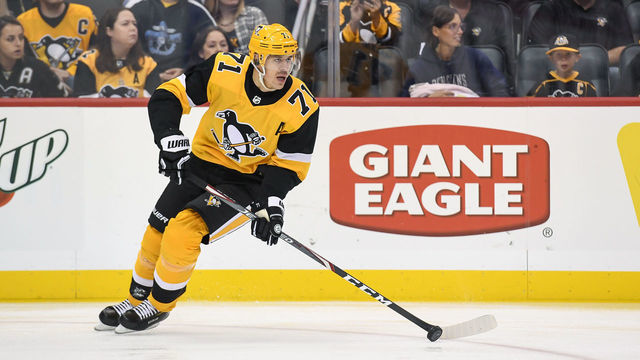 PITTSBURGH, PA - OCTOBER 05: Pittsburgh Penguins Center Evgeni Malkin (71) skates with the puck during the first period in the NHL game between the Pittsburgh Penguins and the Columbus Blue Jackets on October 5, 2019, at PPG Paints Arena in Pittsburgh, PA.