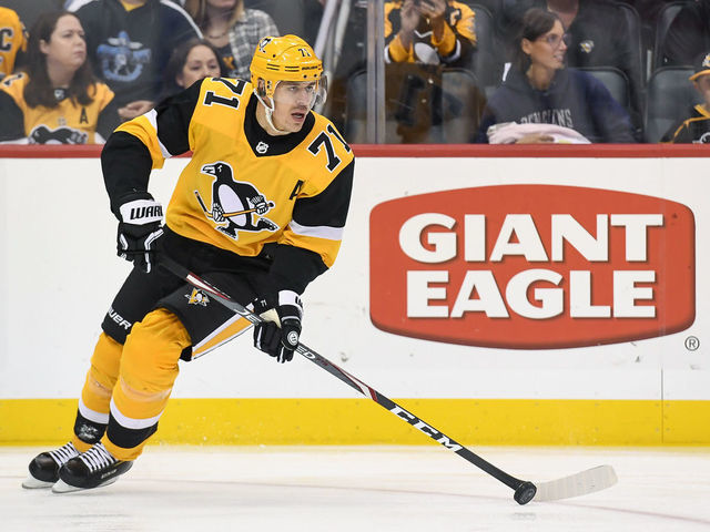 PITTSBURGH, PA - OCTOBER 05: Pittsburgh Penguins Center Evgeni Malkin (71) skates with the puck during the first period in the NHL game between the Pittsburgh Penguins and the Columbus Blue Jackets on October 5, 2019, at PPG Paints Arena in Pittsburgh, PA.