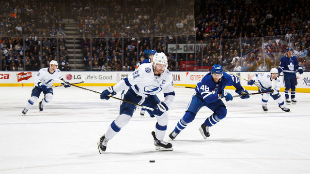 TORONTO, ON - APRIL 04: Steven Stamkos #91 of the Tampa Bay Lightning skates against Calle Rosen #48 of the Toronto Maple Leafs during the second period at the Scotiabank Arena on April 4, 2019 in Toronto, Ontario, Canada.