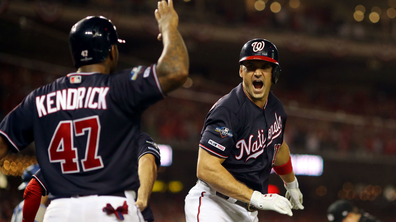 WASHINGTON, DC - OCTOBER 07: Ryan Zimmerman #11 of the Washinton Nationals is greeted by teammate Howie Kendrick #47 after hitting a three-run home run in the fifth inning during Game 4 of the NLDS between the Los Angeles Dodgers and the Washington Nationals at Nationals Park on Monday, October 7, 2019 in Washington, District of Columbia.