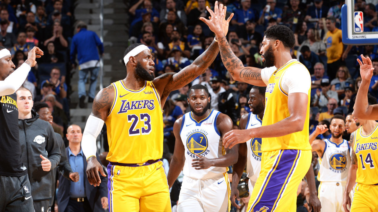 SAN FRANCISCO, CA - OCTOBER 5: LeBron James #23 and Anthony Davis #3 of the Los Angeles Lakers high-five during a pre-season game against the Golden State Warriors on October 5, 2019 at Chase Center in San Francisco, California. NOTE TO USER: User expressly acknowledges and agrees that, by downloading and/or using this Photograph, user is consenting to the terms and conditions of the Getty Images License Agreement. Mandatory Copyright Notice: Copyright 2019 NBAE