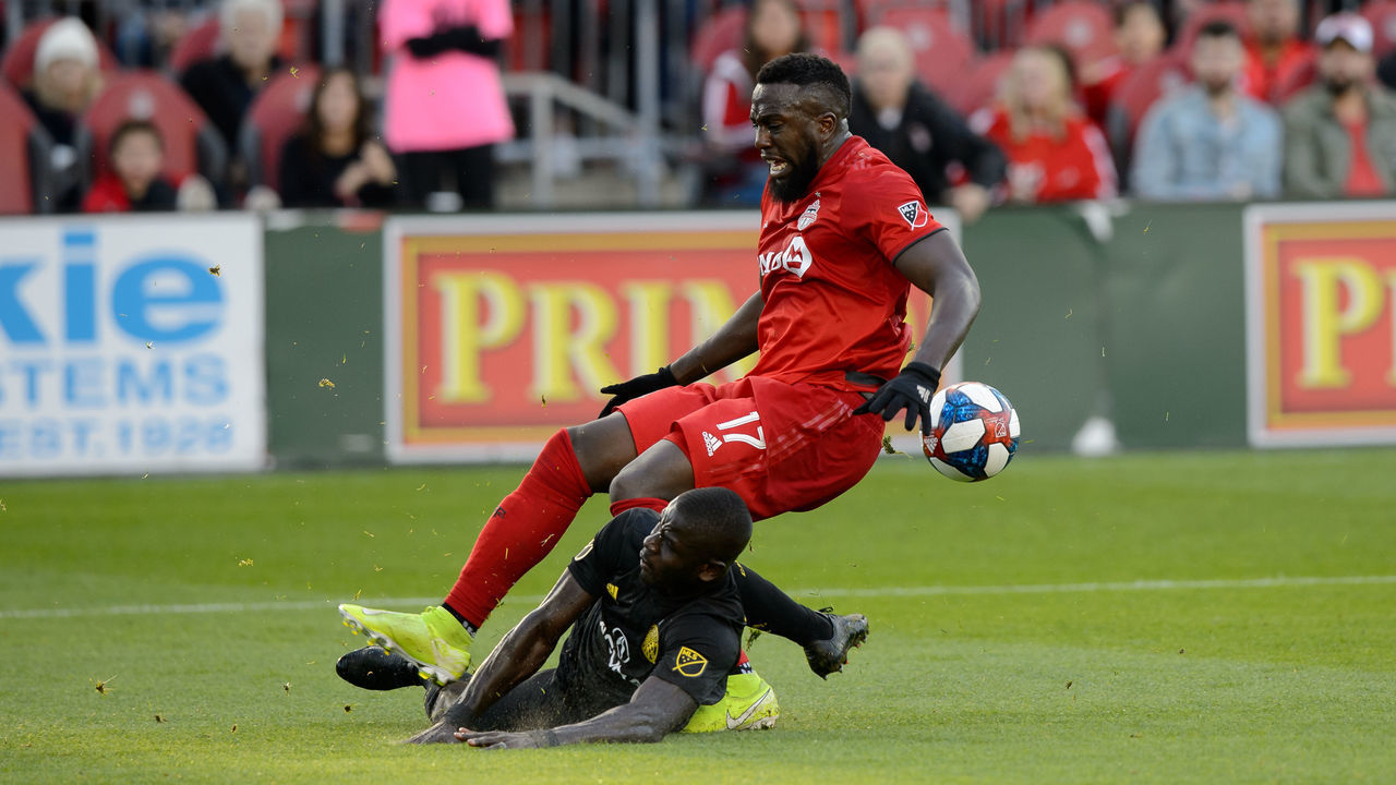 TORONTO, ON - OCTOBER 06: Jozy Altidore (17) of Toronto FC gets injured on a sliding tackle by Jonathan Mensah of Columbus Crew (4) during the second half of the MLS regular season match between Toronto FC and Columbus Crew on October 6, 2019, at BMO Field in Toronto, ON, Canada.