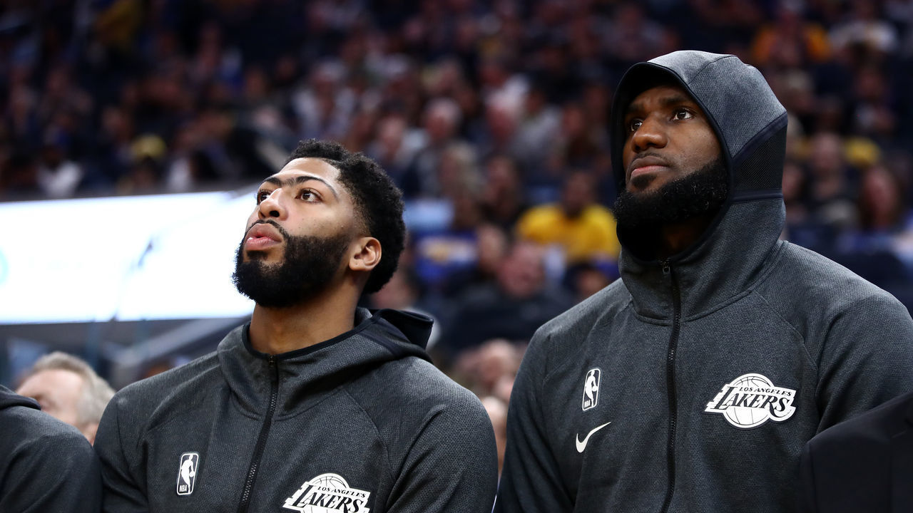 SAN FRANCISCO, CALIFORNIA - OCTOBER 05: Anthony Davis (left) #3 sits next to LeBron James #23 of the Los Angeles Lakers during their game against the Golden State Warriors at Chase Center on October 05, 2019 in San Francisco, California.