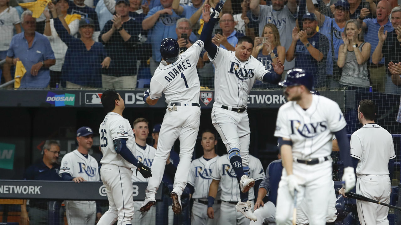 ST. PETERSBURG, FL - OCTOBER 08: Tampa Bay Rays shortstop Willy Adames (1) celebrates with Tampa Bay Rays right fielder Avisail Garcia (24) after hitting a solo home run in the 4th inning of Game 4 of the ALDS between the Houston Astros and Tampa Bay Rays on October 8, 2019 at Tropicana Field in St. Petersburg, FL.
