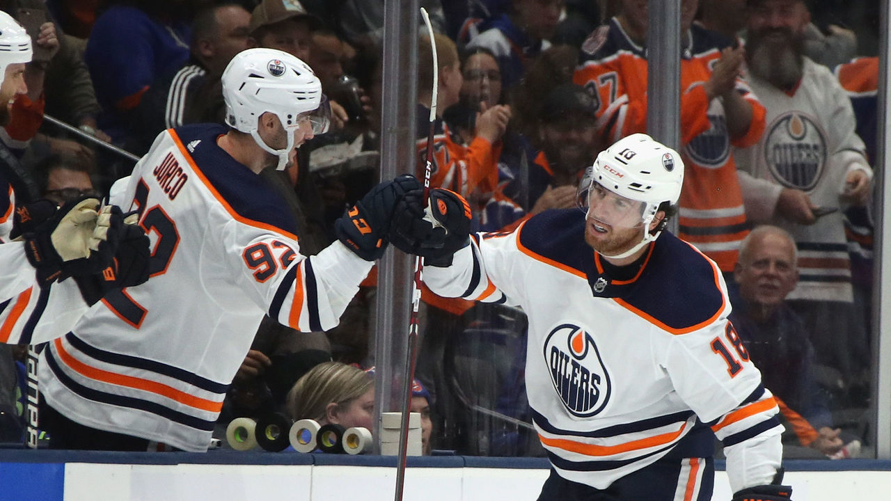 NEW YORK, NEW YORK - OCTOBER 08: James Neal #18 of the Edmonton Oilers scores his hat-trick goal on the power-play at 6:31 of the third period against the New York Islanders at NYCB's LIVE Nassau Coliseum on October 08, 2019 in Uniondale, New York.